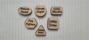 6 climatopia wooden pieces on piece of paper