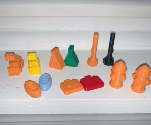 3D game pieces printed out in various colors