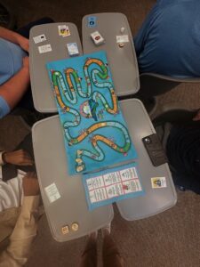 Climatopia game on desks with game cards and pieces