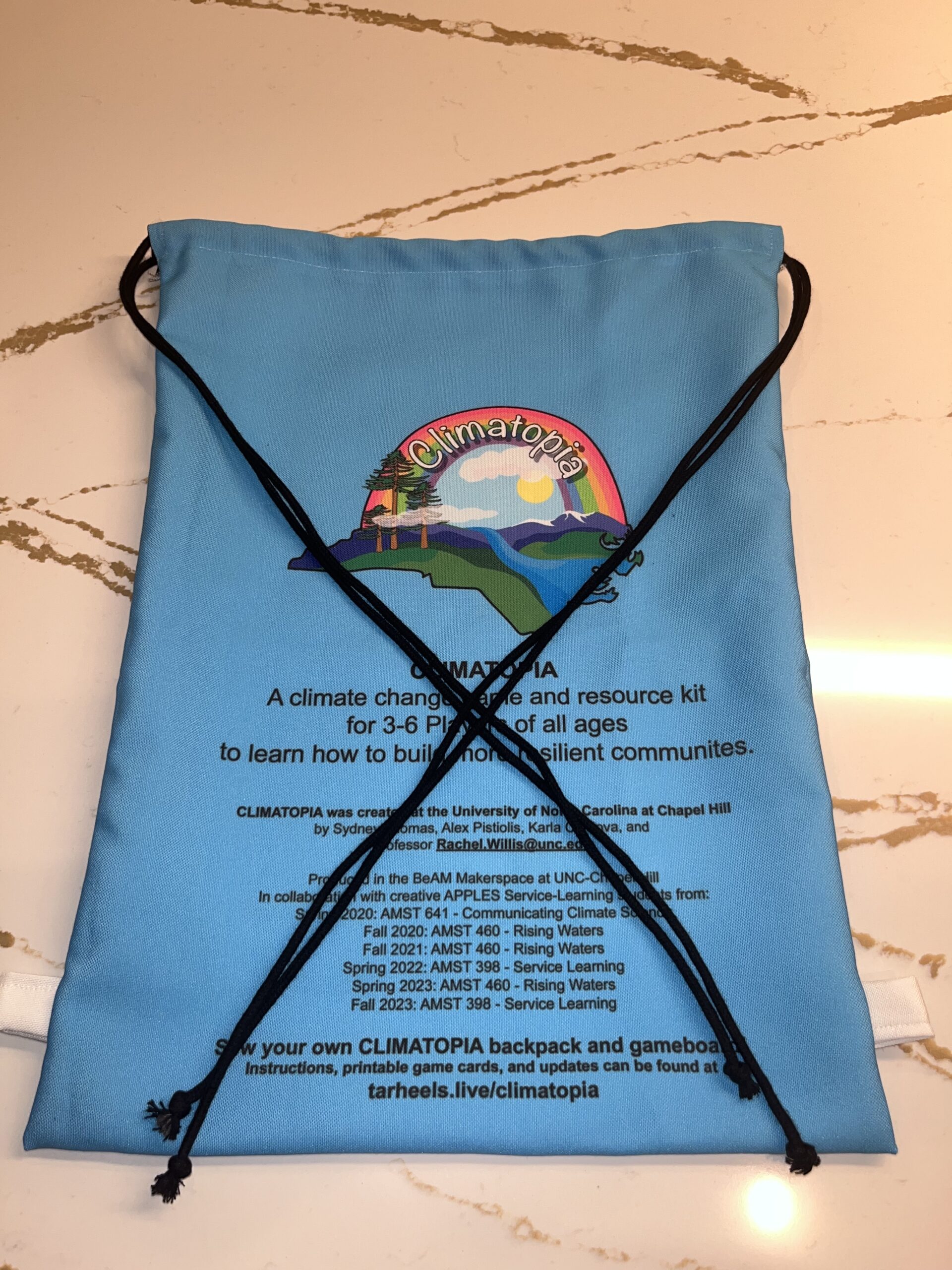 Climatopia drawstring bag with the cords in an x over the bag
