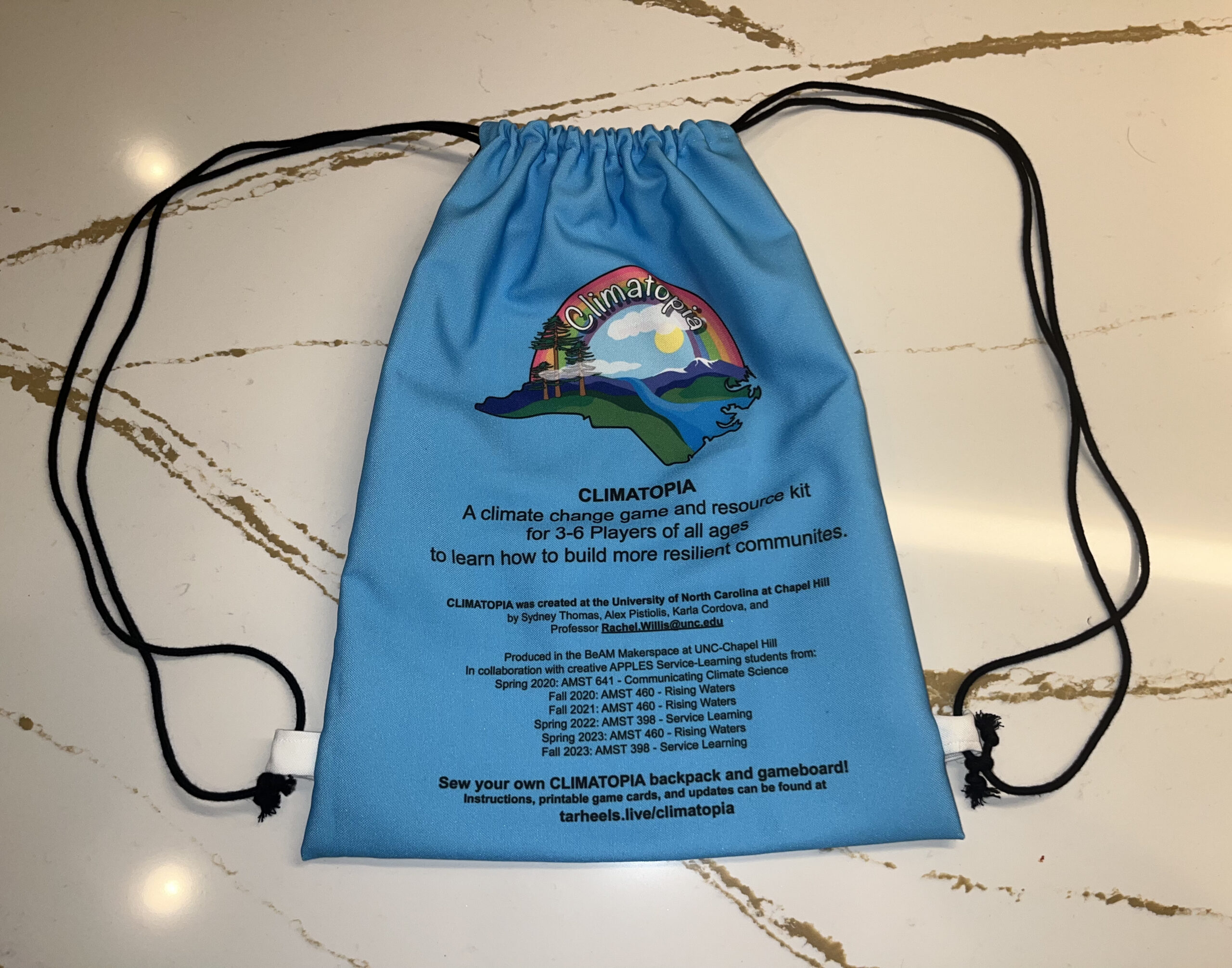 Completed Climatopia drawstring bag on white surface