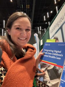 Magaret Anton with her new book at ABCT 2023