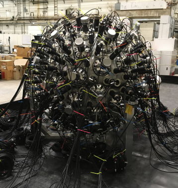 The Nudot equipment. It is a large ball object connecting numerous cables and sensors. 