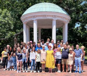 Student and faculty of the IYAP summer program pose together in front of the Old Well.