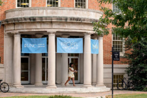 Student walking outside of Peabody Hall